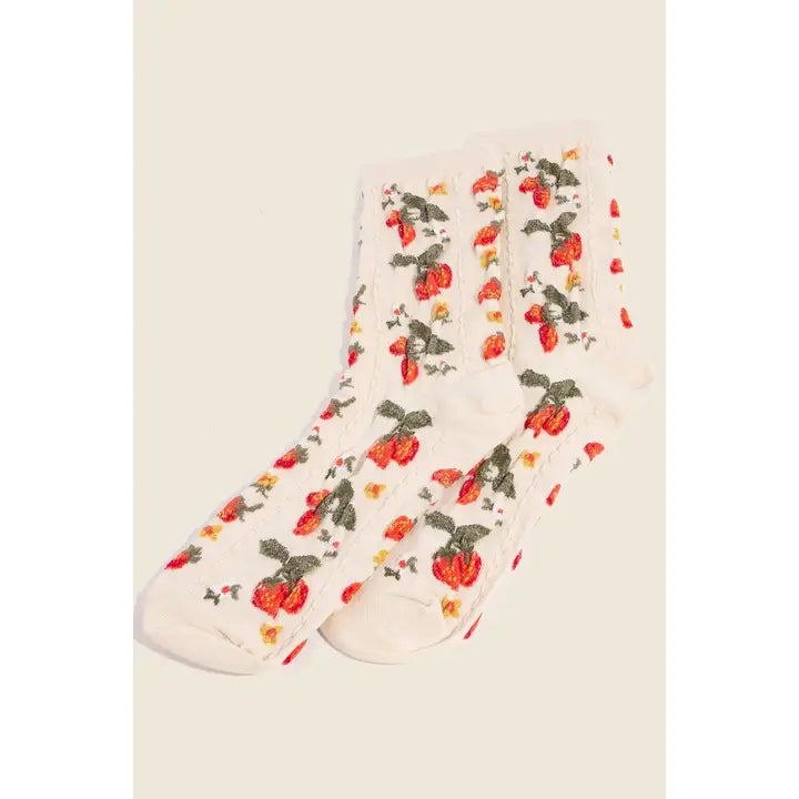 Floral-patterned socks on a beige background